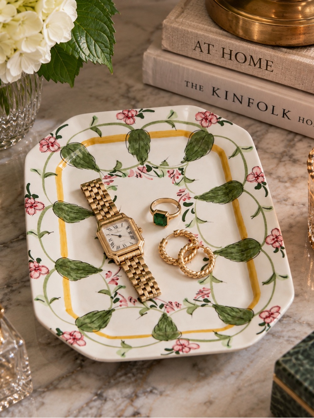 Gold Bracelet Watch & Jewelry Display with Green Accents